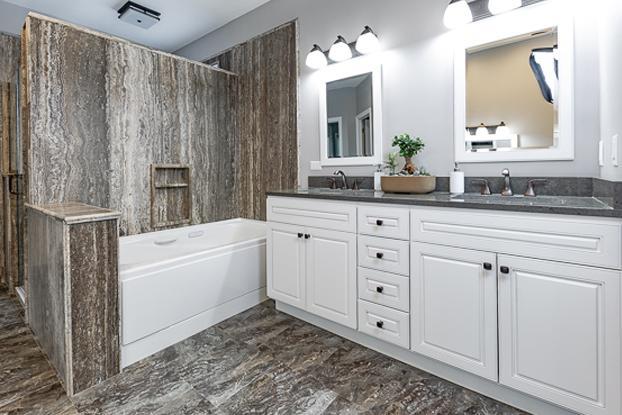 Replacing your outdated corner bathtub to a jetted tub that features hydrotherapy, chromatherapy, and aromatherapy is what custom bathroom designs at ReBath Omaha are all about. Pair that with a sexy custom bathroom vanity and natural travertine slab surround and you have a dream bathroom remodel your friends and family will envy.
