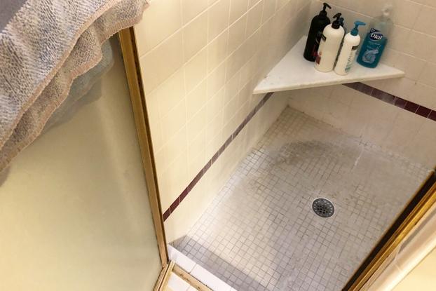 Tile and grout shower floors are some of the most disgusting situations we run into. The grout soaks in the water and oils from your body causing mold under the tiles and discoloration that just cannot be cleaned. This shower also is too small to even shower efficiently in and ugly and outdated in design. Definitely in need of a demolition and shower update by ReBath Omaha and their free design services and fast, easy installation process.