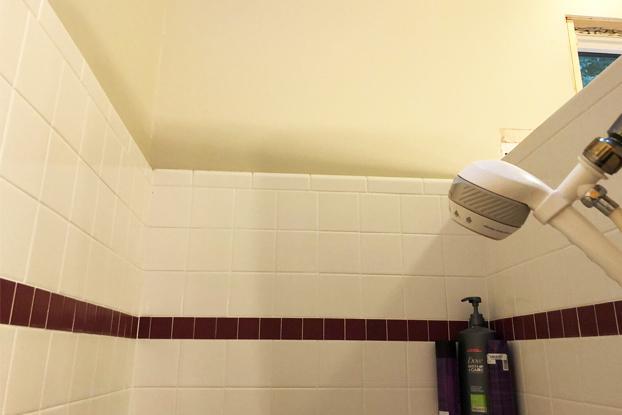 A shower replacement will always be in your future if you opt for tile and grout as your bathroom solution because the grout is porous allowing water behind the tile leading to mold growth where you can't see it and discoloration of the grout and tile where you can see it.