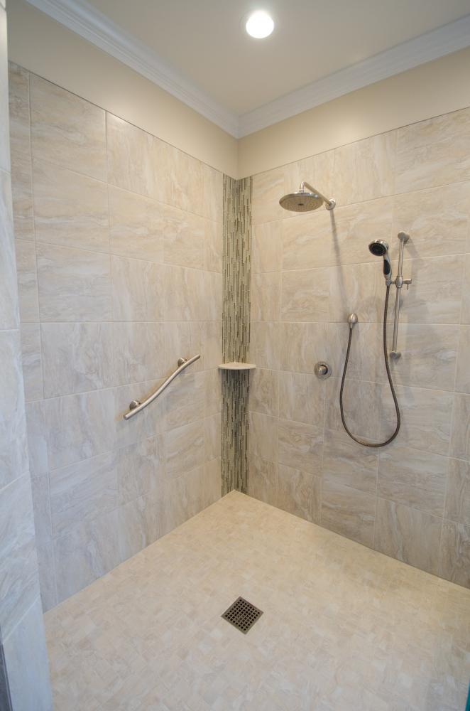 Wheelchair accessible shower, safety handlebar, shower shelf, waterfall shower head, and adjustable shower head