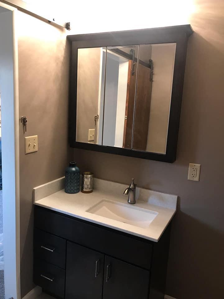 After Re-Bath Great Bend, KS renovation with a new modern vanity and medicine cabinet fit so much better in this master bath.