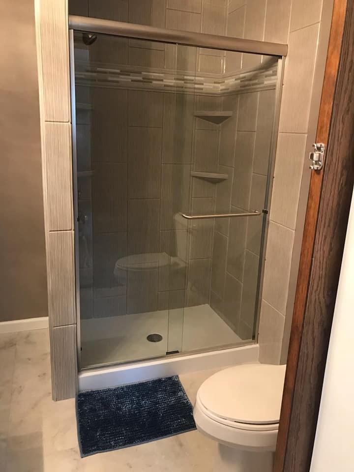 We completely gutted the old bathroom and changed the layout to accommodate a larger shower.