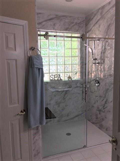 Arizona Shower Door - The Canyon Frameless 3/8 Door and fixed Panel
Moen- Shower Head, Hand Held on a slide bar, and the easy to reach diverter
Re-Bath -Durabath walls in White Calcutta
Onyx- Low Threshold Shower Base
Bilanx- Brazilian Walnut Fold Up Seat