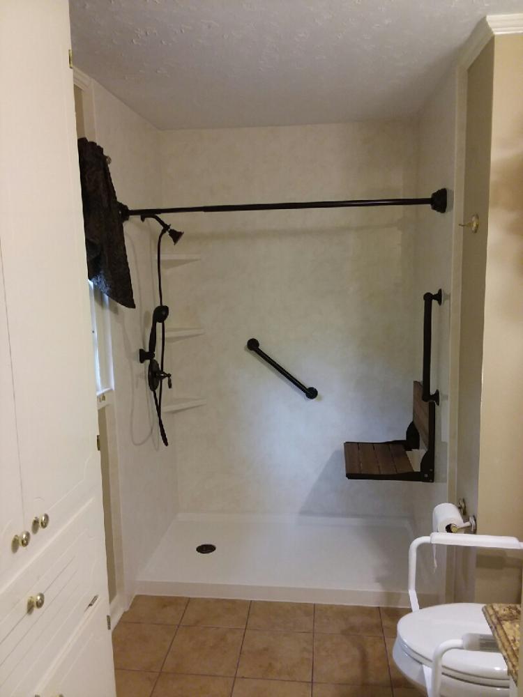 Tub/Shower Converted to barrier free walk in shower with seating and safety bars featured in Dothan, Al
