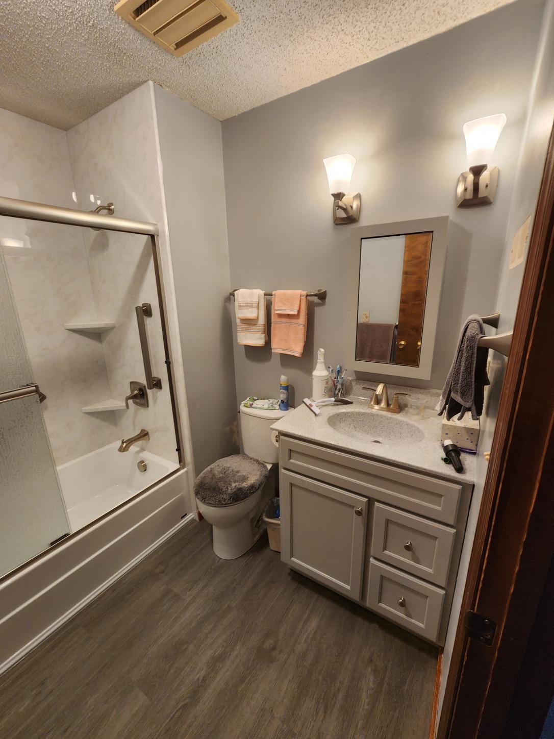 After Re-Bath Decatur, IL remodel with Tahoe granite walls with rain shower head