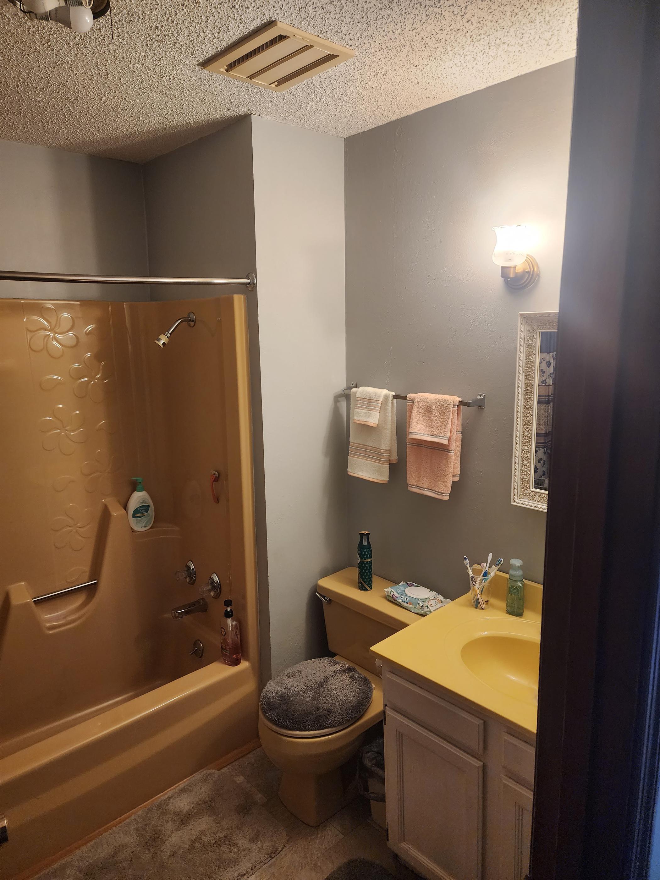 After Re-Bath Decatur, IL renovation with white calcutta walls with a roll-in shower