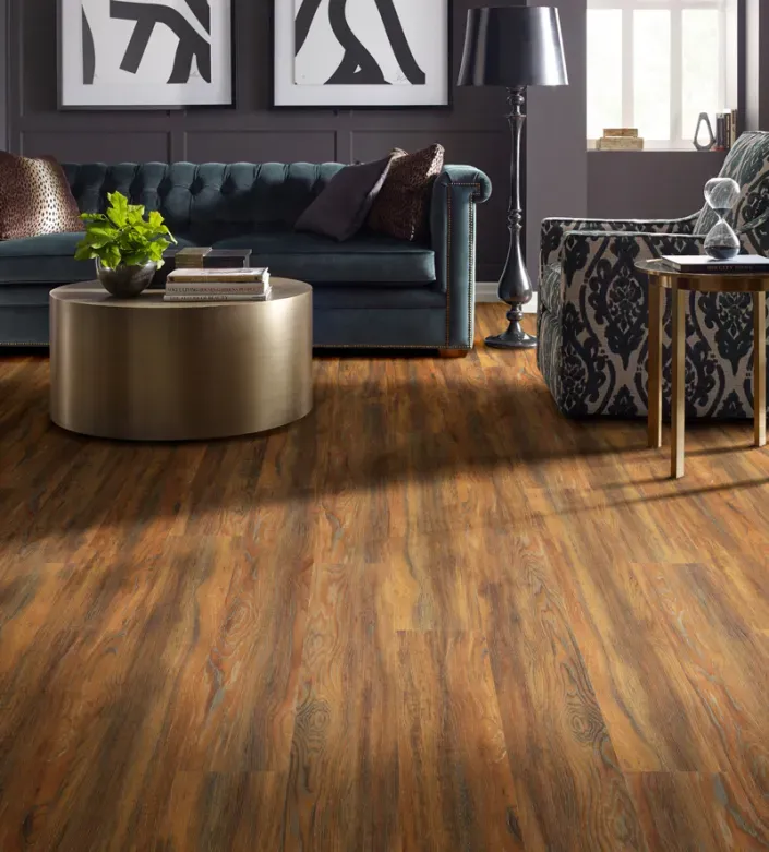 photo of couch and chair in living room with vinyl flooring