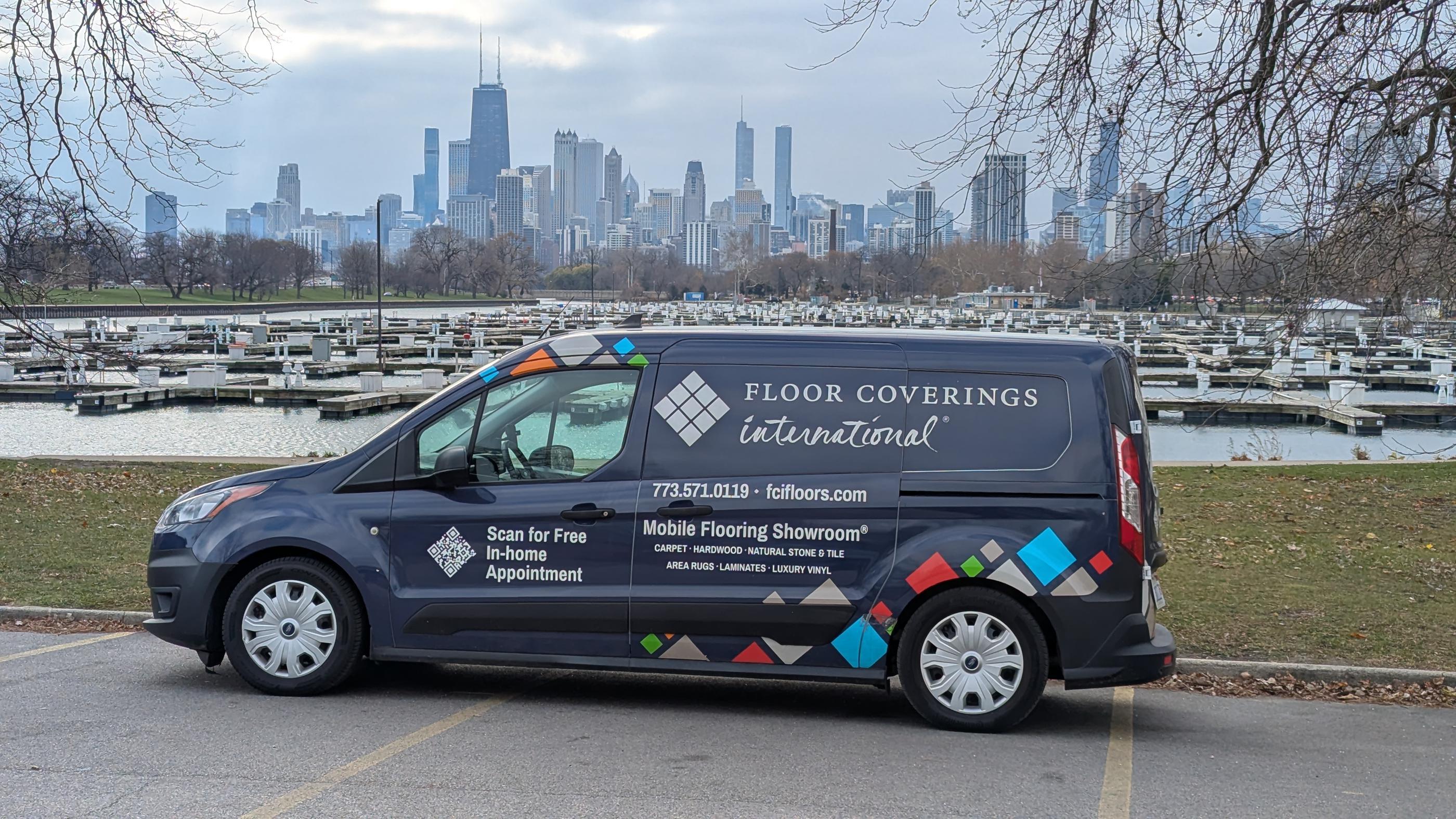 Floor Coverings International van in front of Chicago landscape